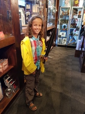 Zeph holding a hobbit-sized stand-in version of Sting