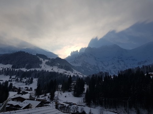 The shadow of mountains cast on the dawn sky