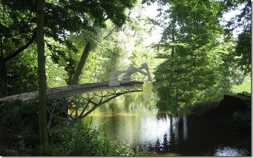 Rendering of robots printing a bridge across a river