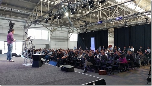 Josh talks to a large, engaged crowd