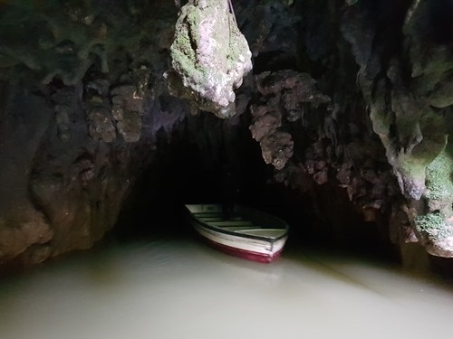 Our boat leaving the cave system
