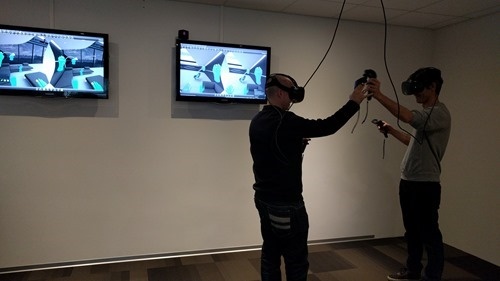 A high five in both virtual and actual reality