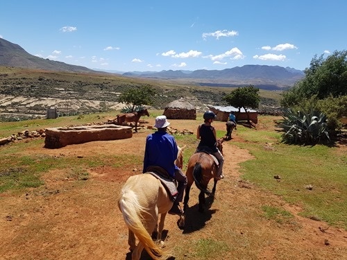 Riding through a village