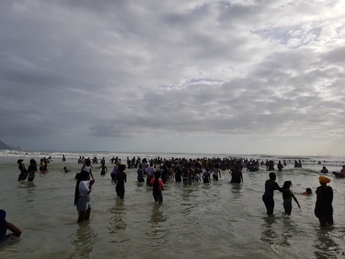People singing and dancing in the water