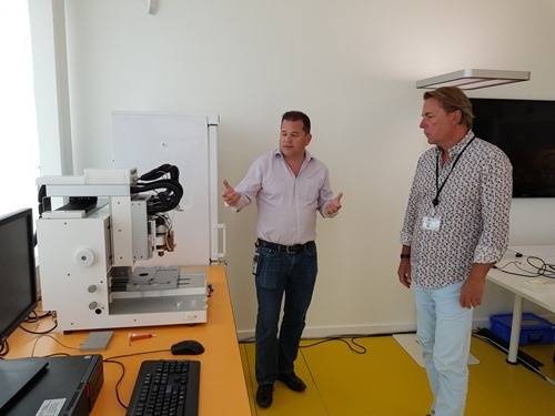 Denis showing Peter a bio-printer