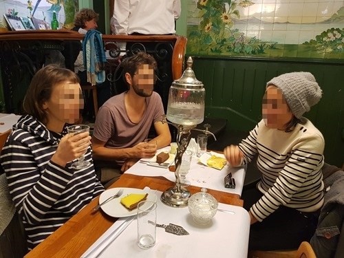 A group drinking absinthe