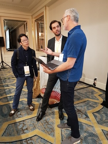 Aaron, Sharif and Mickey discussing